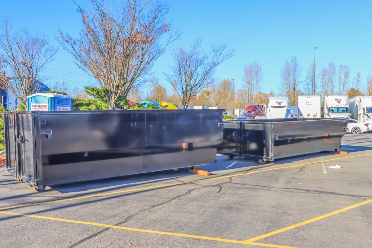 Professional dumpster rental service with roll-off container on residential driveway in White Settlement